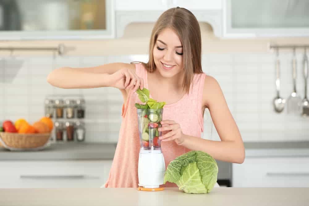 Woman Overfilling the Portable Blender Cup