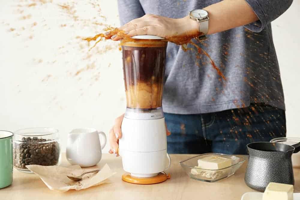 Woman Spilling Coffee During Blending